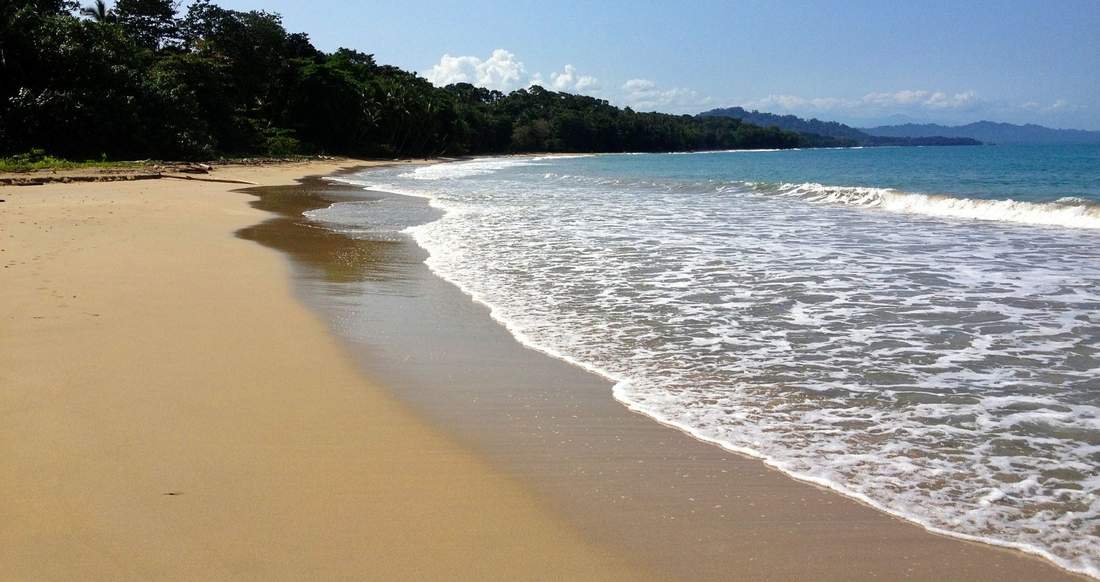 Beaches Costa Rica and Panama Waves come up onto a tranquil sandy beach