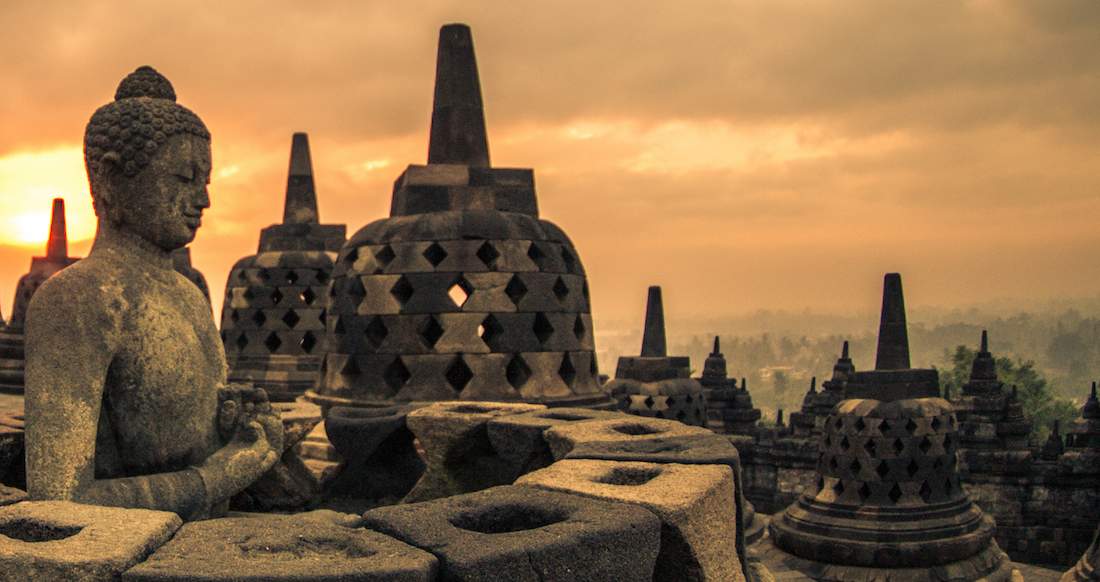 Temple Orange light of sunrise glowing over Buddhist temple