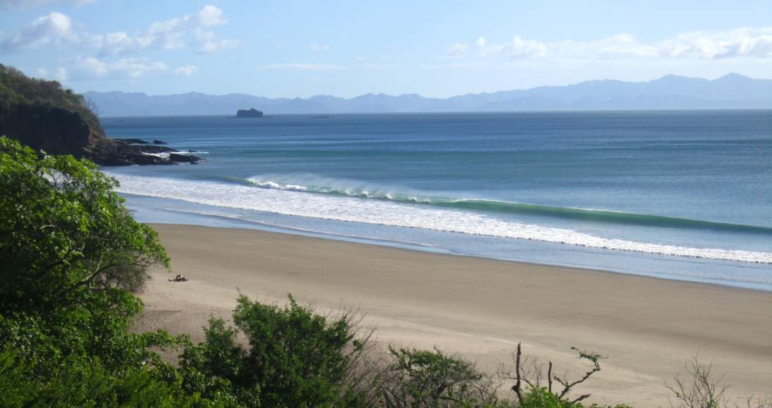 Escemeca Nicaragua Waves crash up on a large, secluded, sandy beach