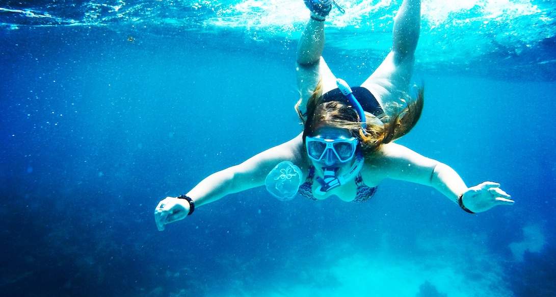 Snorkeling Nicaragua A girl gets close up to a jellyfish while snorkeling