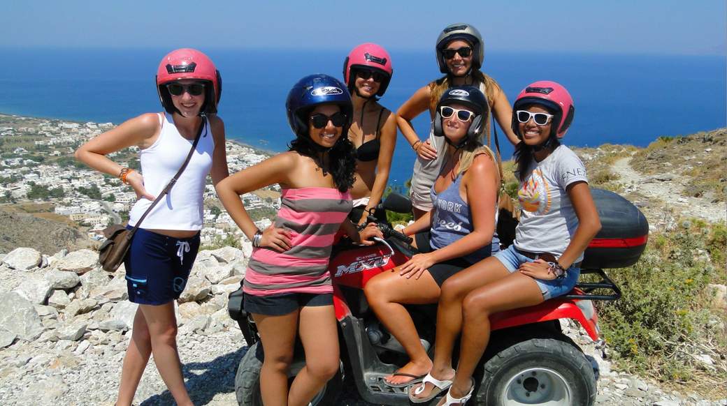 ATV ladies Girls riding ATV's in Greece with a nice viewpoint