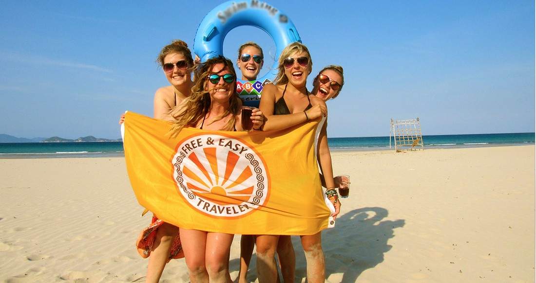 girls on beach beautiful girls on a beach in Vietnam holding a flag