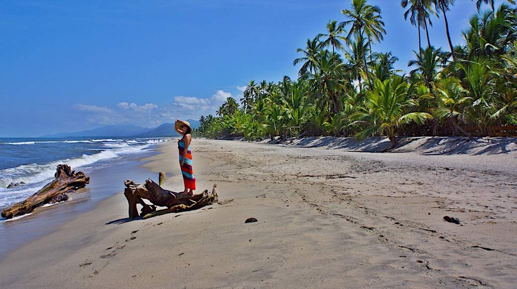 costeno beach a girl admiring the ocean on costeno beach colombia