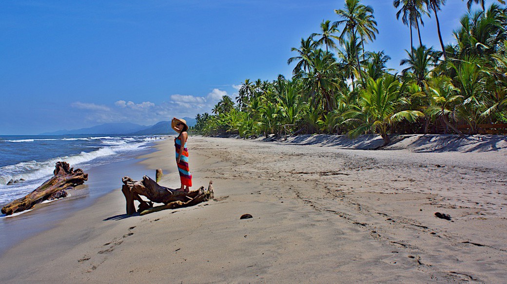 costeno beach a girl admiring the ocean on costeno beach colombia