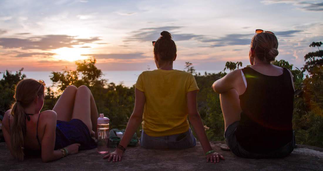 Sunset in the Philippines Three girls watch the sunset in the Philippines