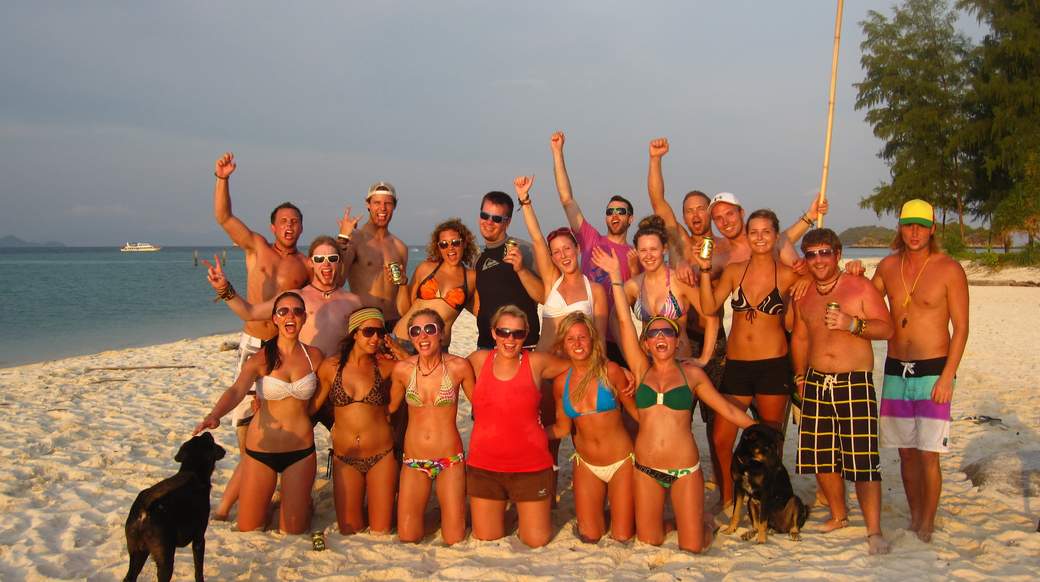Thailand beach group shot Group of happy travelers on a beach in Koh Lipe Thailand