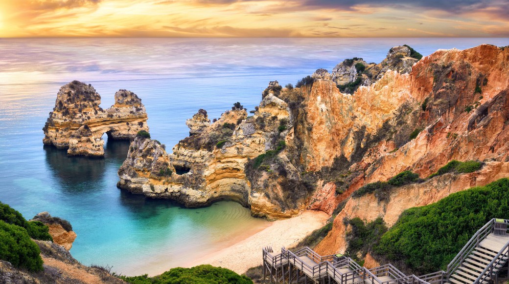 Lagos Portugal beach beautiful view of cliffs surrounding a beach in Lagos Portugal