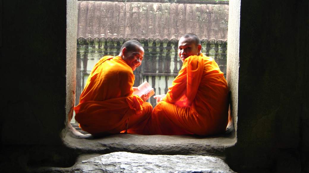 Monks at Angkor Wat Two smiling monks in Angkor Wat Cambodia