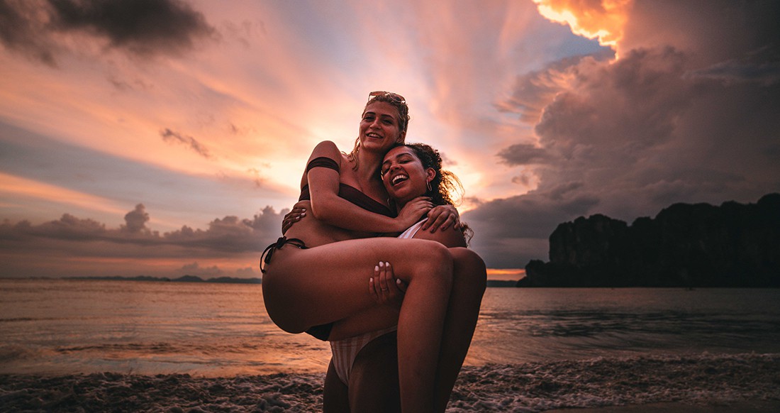 sunset on Railay beach Two girls on Railay beach during sunset in Thailand