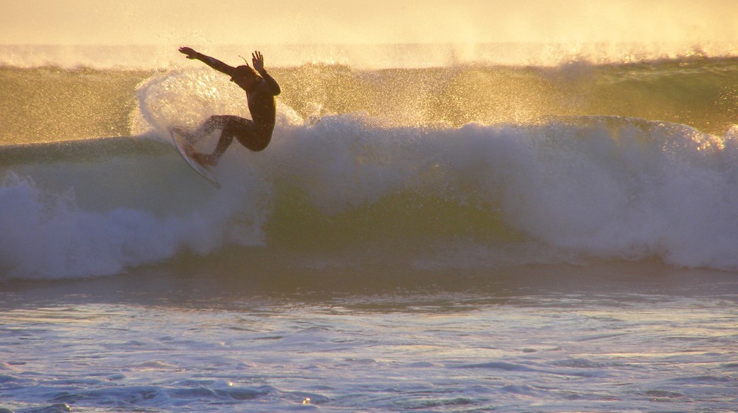 Surfer Sagres dude catching a wave in Sagres Portugal