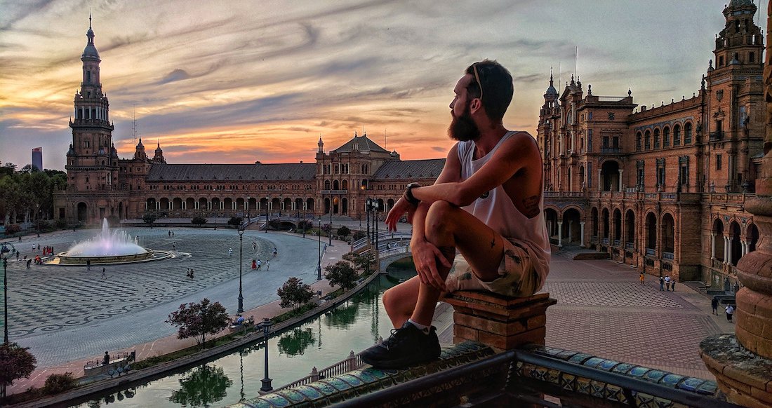 Plaza de Espana A traveler watches sunset at plaza de espana