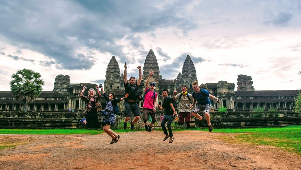 Angkor Jumping A group of travelers jumping with joy in front of Angkor Wat.