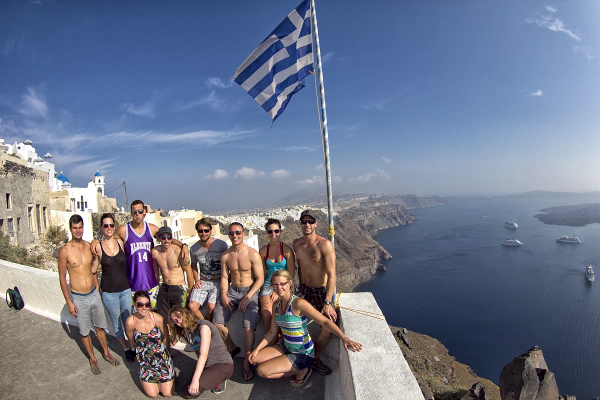 Group of travellers at Santorini viewpoint, Greece