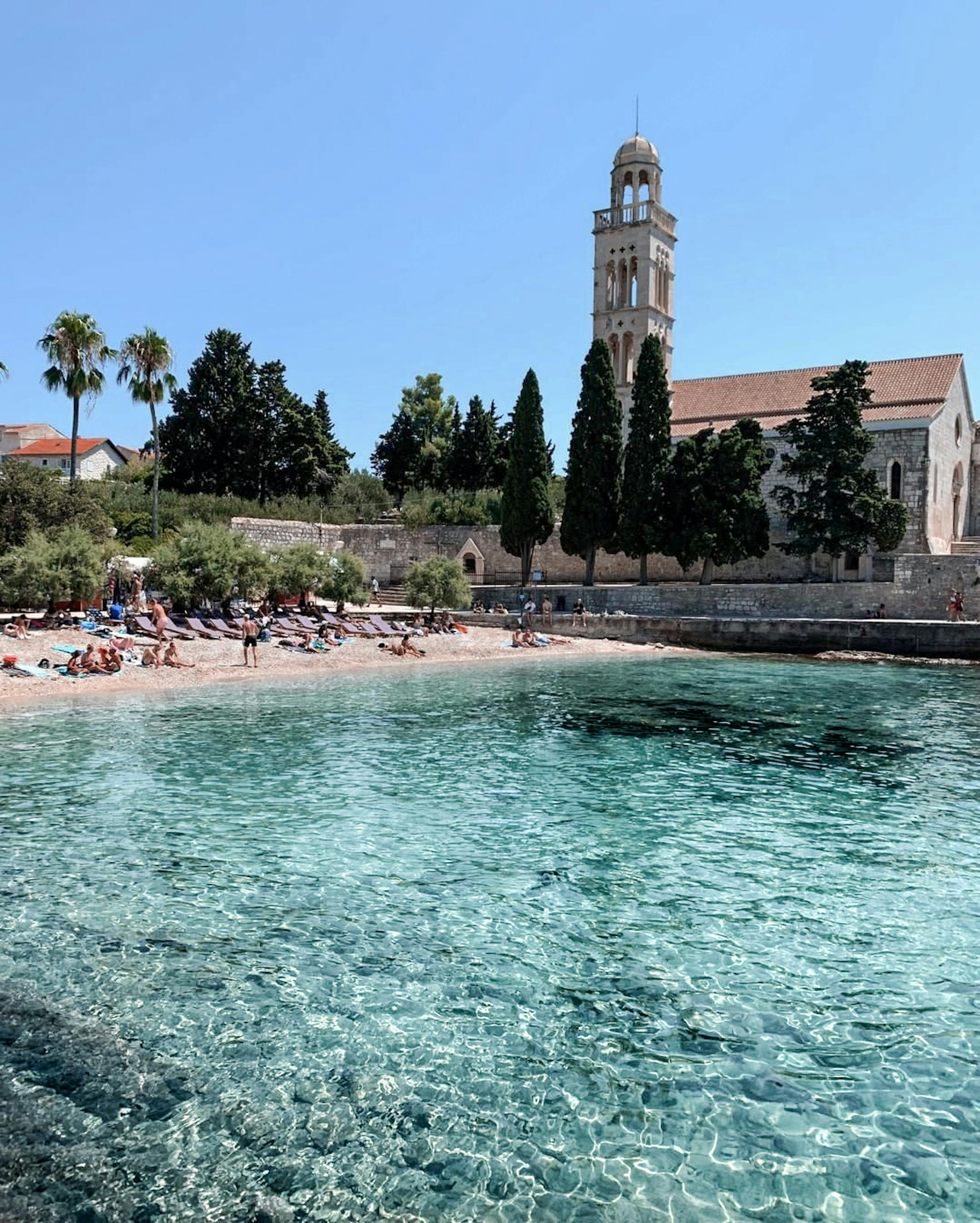 Crystal clear water and monastery beach on Hvar island, Croatia